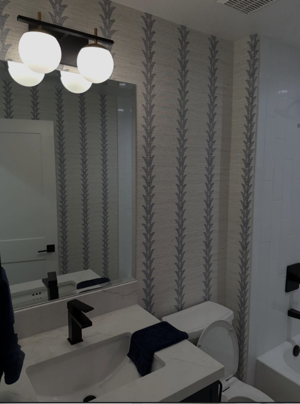 Botanical stripe wallcovering in a powder room