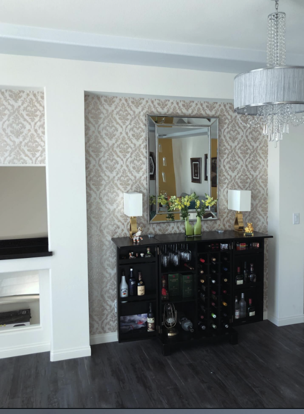 Damask accent wall in a dry bar niche