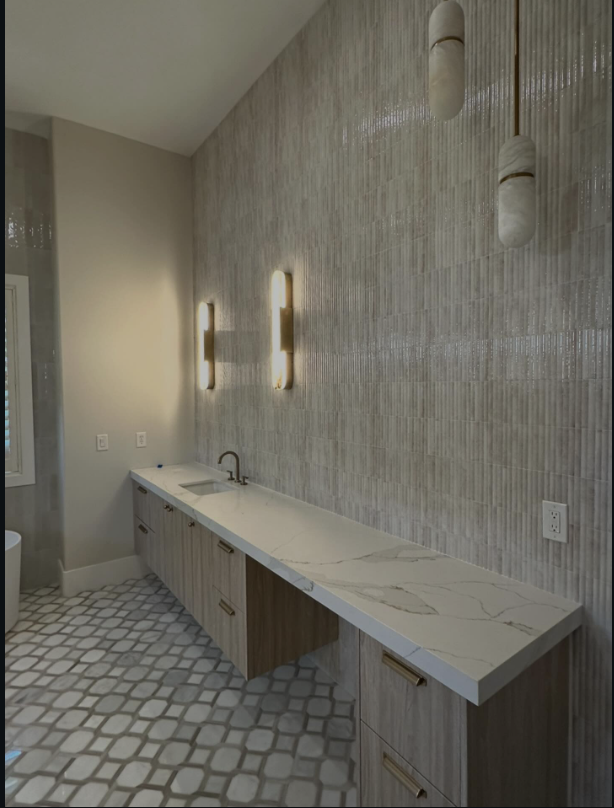 Full-height textured wallcovering behind a bath vanity